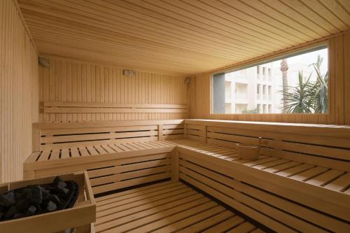 an empty sauna with a large window in it at JAZ Aquaviva in Hurghada