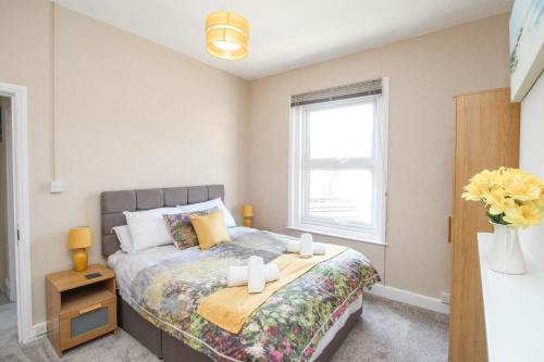 En eller flere senge i et værelse på The Skipper's House