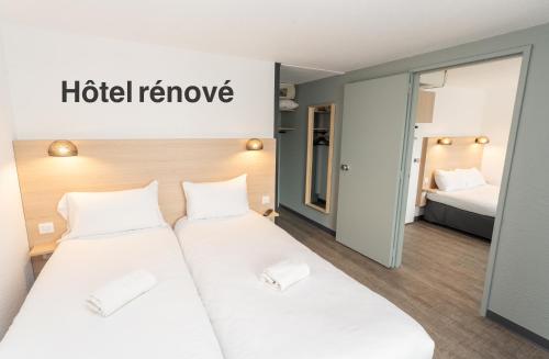 Кровать или кровати в номере Hotel Inn Design La Rochelle