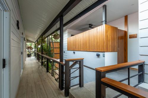 a hallway of a house with a staircase and a stair case at Ventura Santa Teresa in Santa Teresa Beach