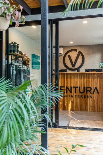 a front door of a store with a volkswagen sign at Ventura Santa Teresa in Santa Teresa Beach