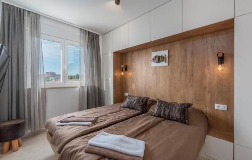 Postel nebo postele na pokoji v ubytování Penthouse Apartment Novigrad