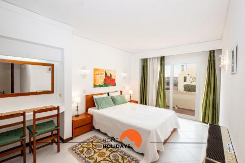 Postel nebo postele na pokoji v ubytování #015 Buganvilia by Home Holidays