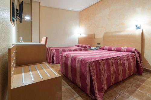 Postel nebo postele na pokoji v ubytování Hotel El Churra