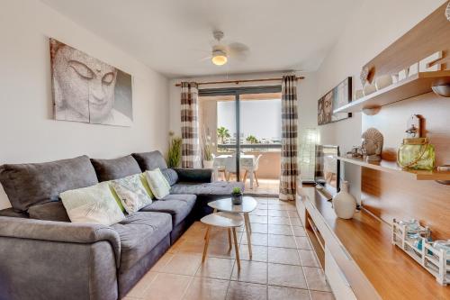 a living room with a couch and a table at Paraiso II EQ FREE WIFI in Playa Paraiso