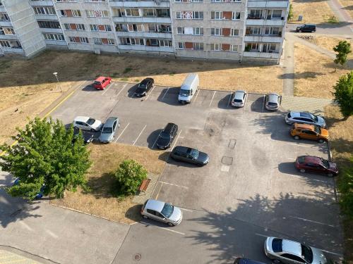 an aerial view of a parking lot with cars at Happy rooms in Ventspils