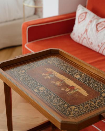 a wooden table with a picture on top of it at Hotel Morfeo in Milan