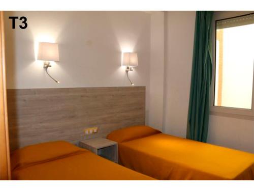 Posteľ alebo postele v izbe v ubytovaní Apartaments Sala Mar