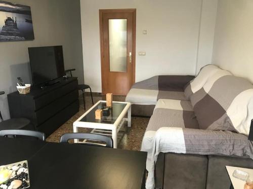 Posezení v ubytování Apartamento cómodo y espacioso con parking