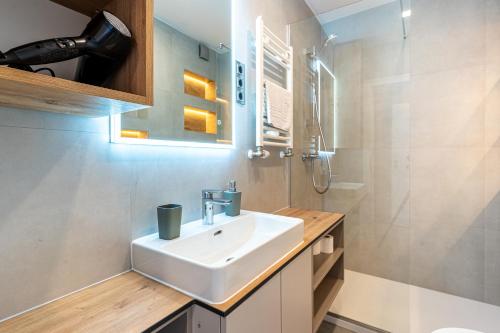 a bathroom with a sink and a shower at Villa Lavanda in Cres