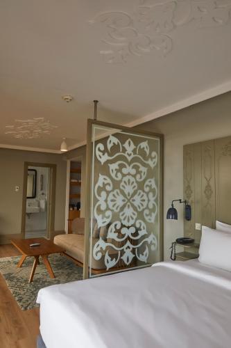 a bedroom with a bed and a living room at The Cettia Istanbul in Istanbul
