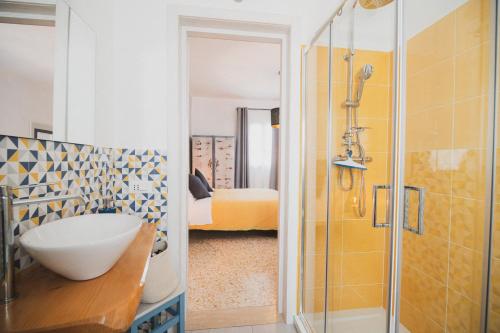 a bathroom with a sink and a shower at Nonna Gina Country House in San Miniato Basso