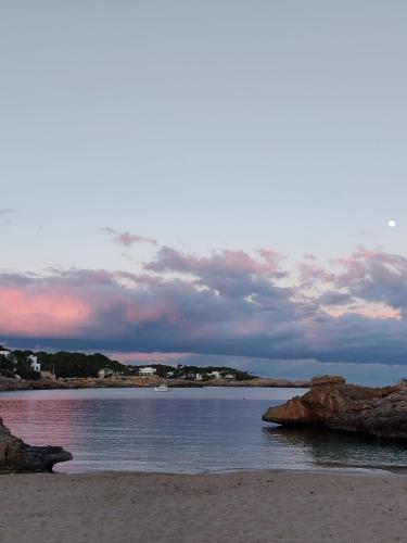 a view of a beach with rocks in the water at Es Forti 52 in Santanyi