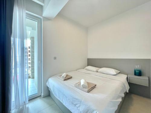 Postel nebo postele na pokoji v ubytování Horizon Residences Andjela