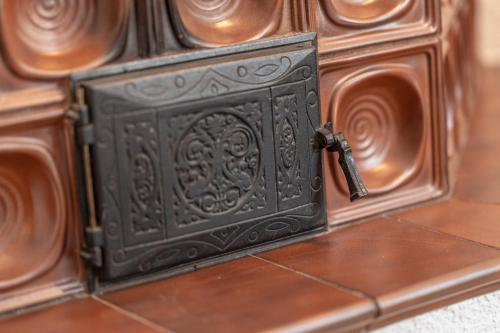 a black metal box with a key on a wall at Garni Zimmerhofer in Campo Tures