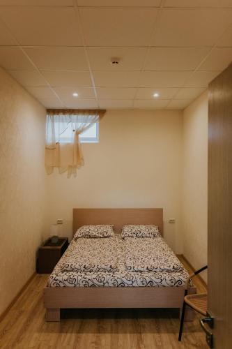 Ένα ή περισσότερα κρεβάτια σε δωμάτιο στο Guest house Baltika