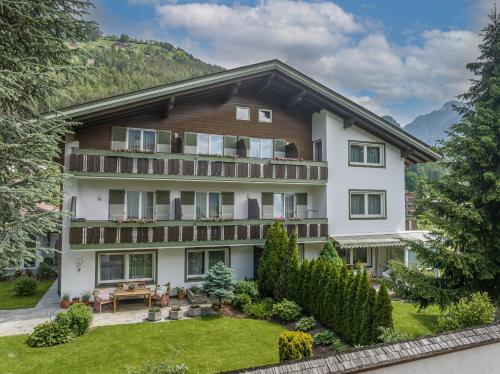an exterior view of a house with a garden at Garni Zimmerhofer in Campo Tures