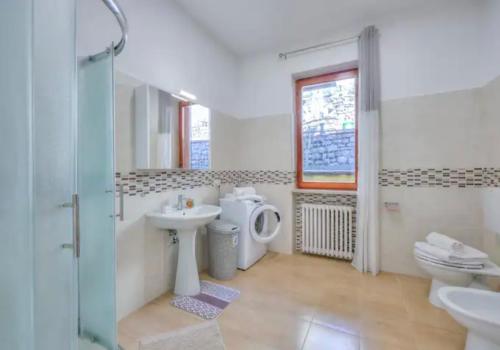 a bathroom with a sink and a toilet at Apartment With View Lake Maggiore/Laveno Mombello in Laveno
