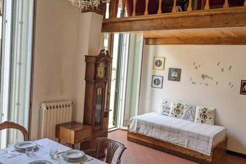 En eller flere senge i et værelse på Casa Armonia