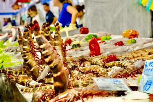 a bunch of seafood on display at a market at 2-Bedroom Beachside Apartment with Pool & Parking in Quarteira