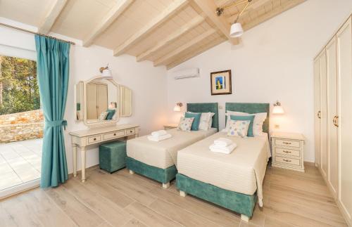 Postel nebo postele na pokoji v ubytování Villa Steno