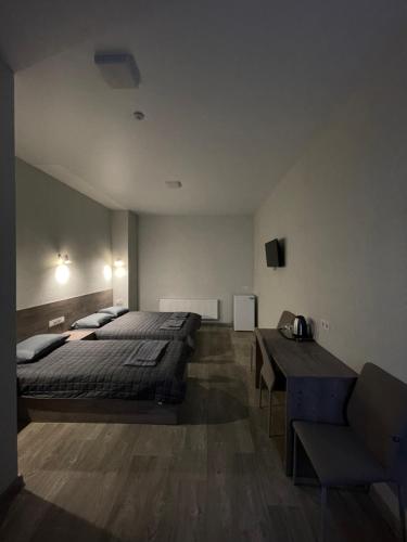 Postel nebo postele na pokoji v ubytování Hotel Voyage Вояж