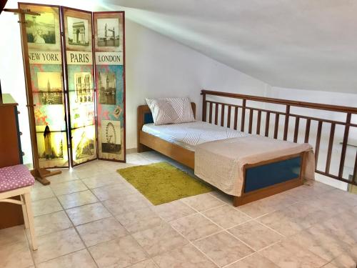 a bedroom with a bed and a tiled floor at Seaside escape in Ormos Panagias