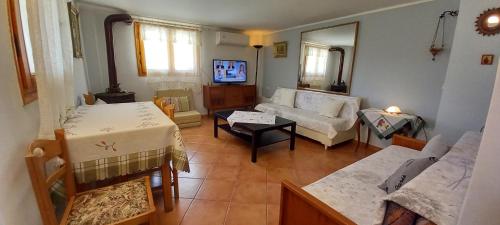 a living room with a couch and a table at Porto Vito in Porto Germeno