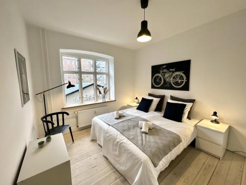 Ένα ή περισσότερα κρεβάτια σε δωμάτιο στο Perfect Apartment For Travelers On A Budget - But Still Wants Quality