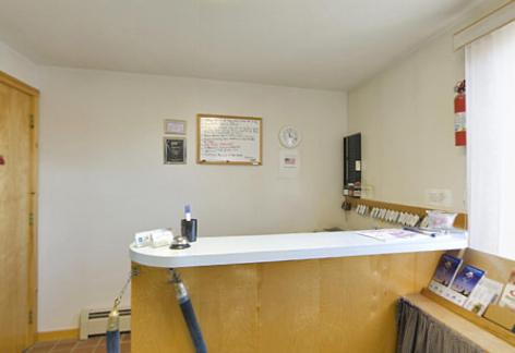 a kitchen with a counter in a room at Americas Best Value Inn Biddeford in Biddeford