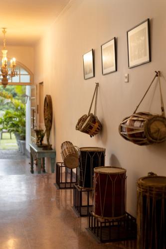 a room with baskets hanging on the wall at Ru Boutique in Kandy