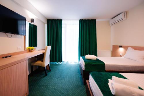 Hotel Parc tesisinde bir odada yatak veya yataklar