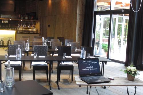 a laptop computer sitting on a table in a restaurant at Hotel & Restaurant Grenzhof in Heidelberg