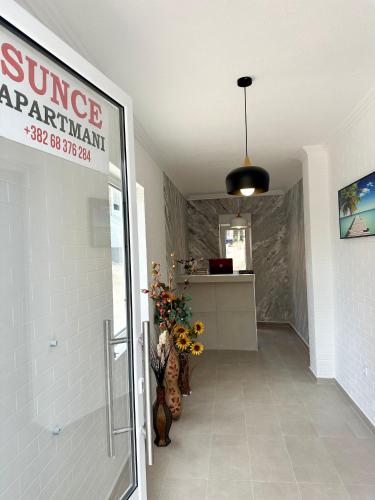 a bathroom with a sign for a garage apartment at Apartmani Sunce in Bar