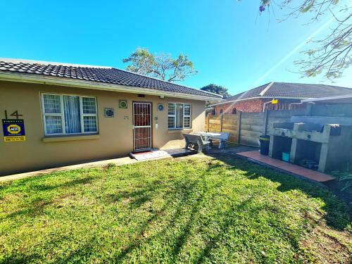 a house with a lawn in front of it at eagles inn in Richards Bay