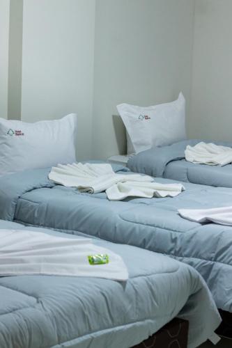 Postel nebo postele na pokoji v ubytování Hotel Beirut