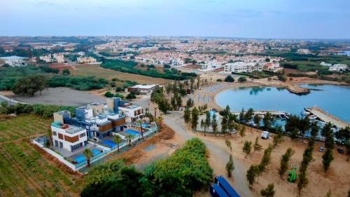 an aerial view of a resort and a lake at Sunrise Beachfront Villas - Villa 1 in Paralimni