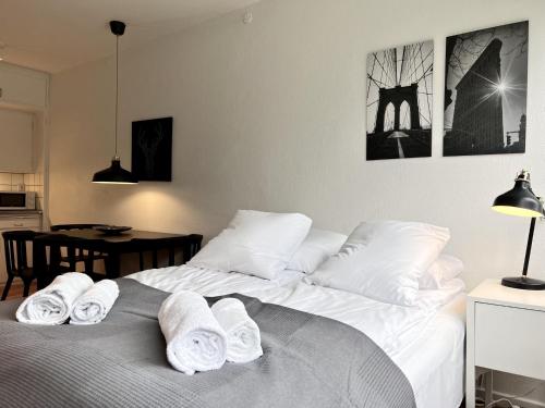 a bedroom with two beds with towels on them at Studio Apartment In Rdovre, Trnvej 49d, 3 in Rødovre