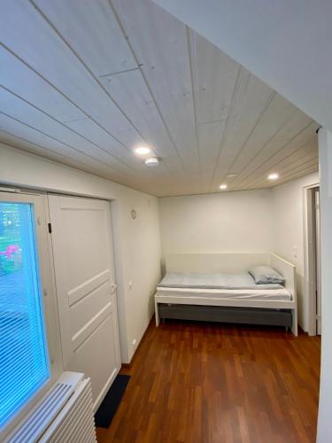 a room with a bed and a window in it at Big Duplex, 15min to Turku or Naantali in Turku