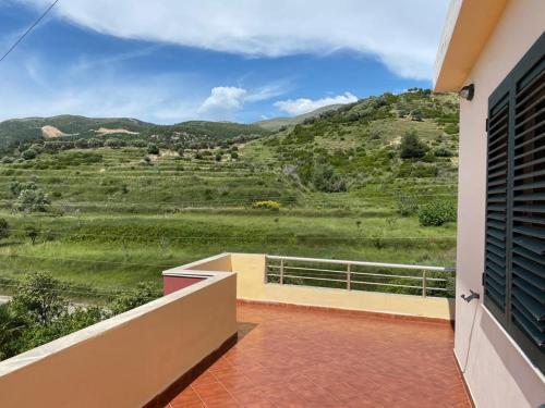 a balcony with a view of a mountain at Hotel Dini in Vlorë