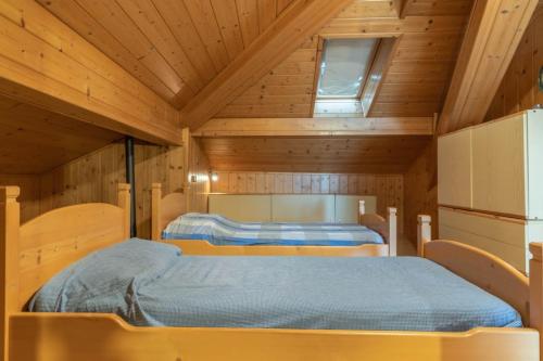 Postel nebo postele na pokoji v ubytování Casa ai Tre Colli, Tres