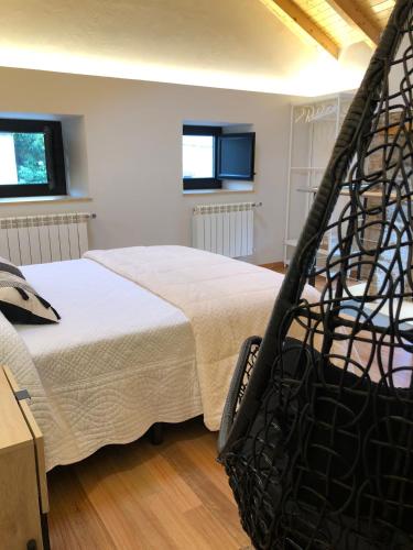 a bedroom with a large bed in a room at Apartamentos El Arroyo in Armal