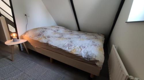 Säng eller sängar i ett rum på Leef Zuiden