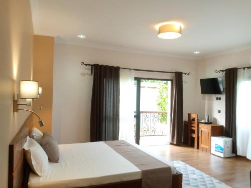 Llit o llits en una habitació de SOA LIA HOTEL