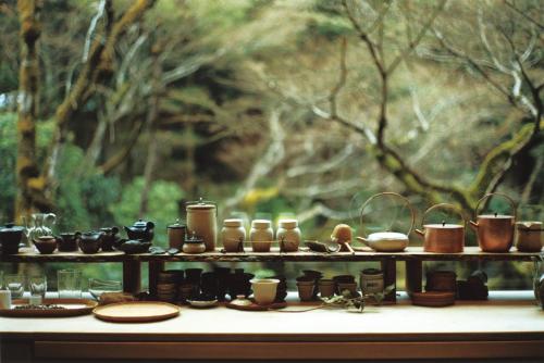a display of pots and pans on a table at moksa in Kyoto