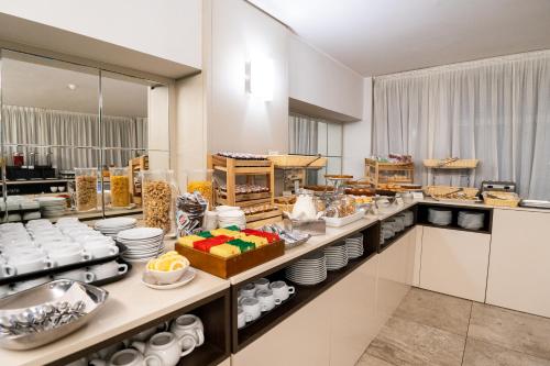 a buffet line with a lot of food at Hotel Como in Como