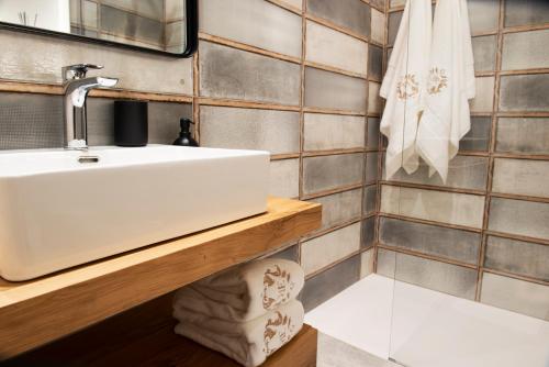 a bathroom with a sink and a towel at ELEGANCE ROOM - Aparta & Suite - Automatized Apartment in Bassano del Grappa