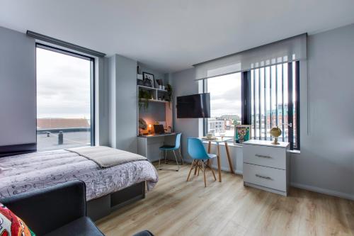 a bedroom with a bed and a desk at Yugo Explore - Kavanagh Court in Dublin