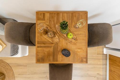 a wooden table with fruits and vegetables on it at Naxos Anamnisi in Plaka