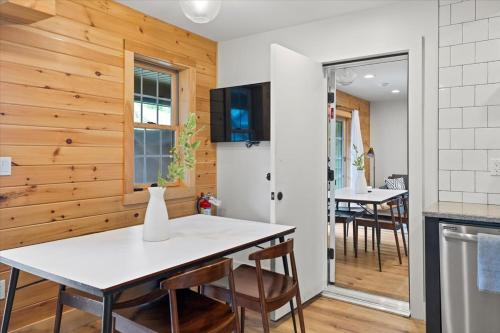 a kitchen and dining room with a table and chairs at Lakeside Lodging in Lake George